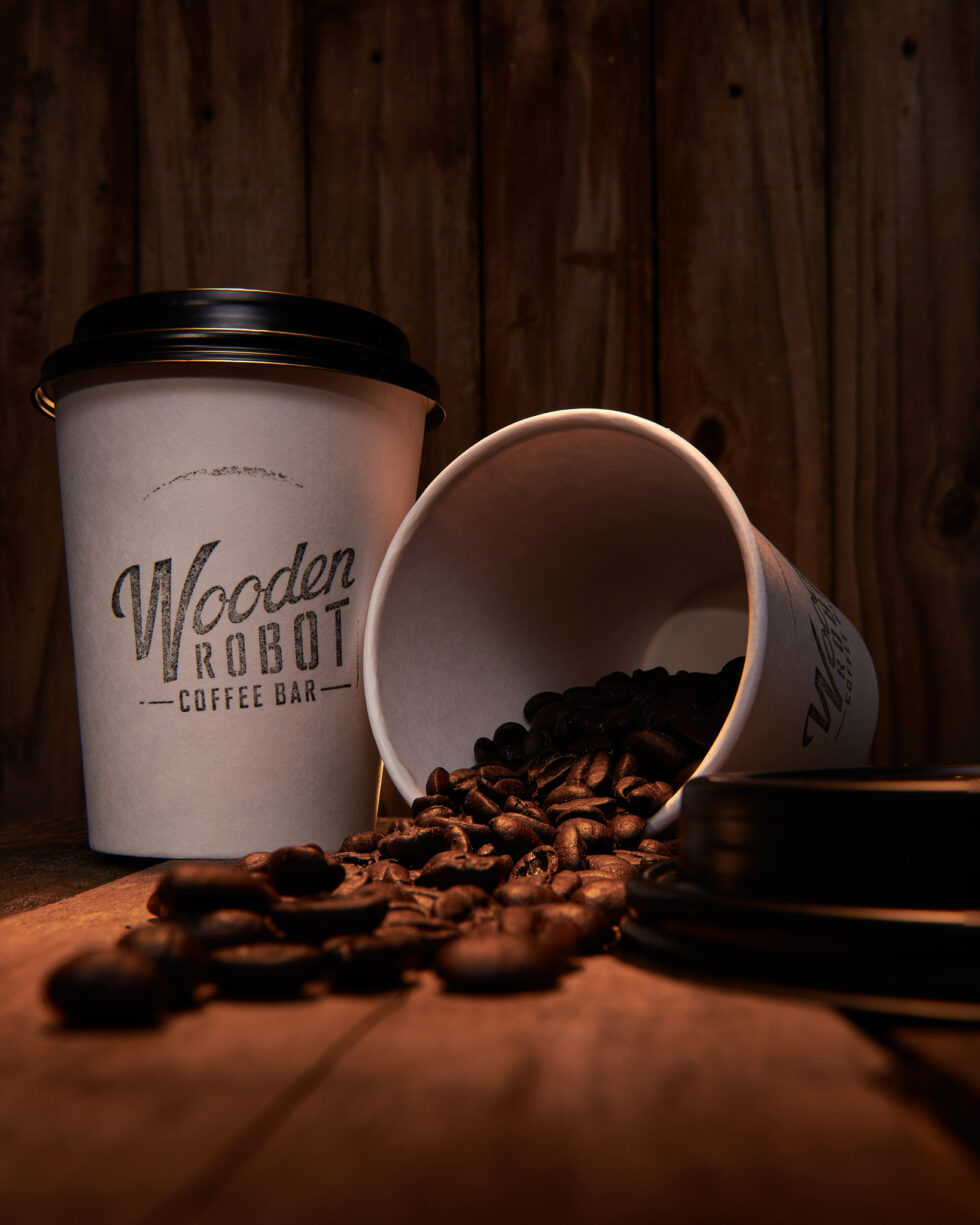 Image of Wooden Robot Coffee cup and beans