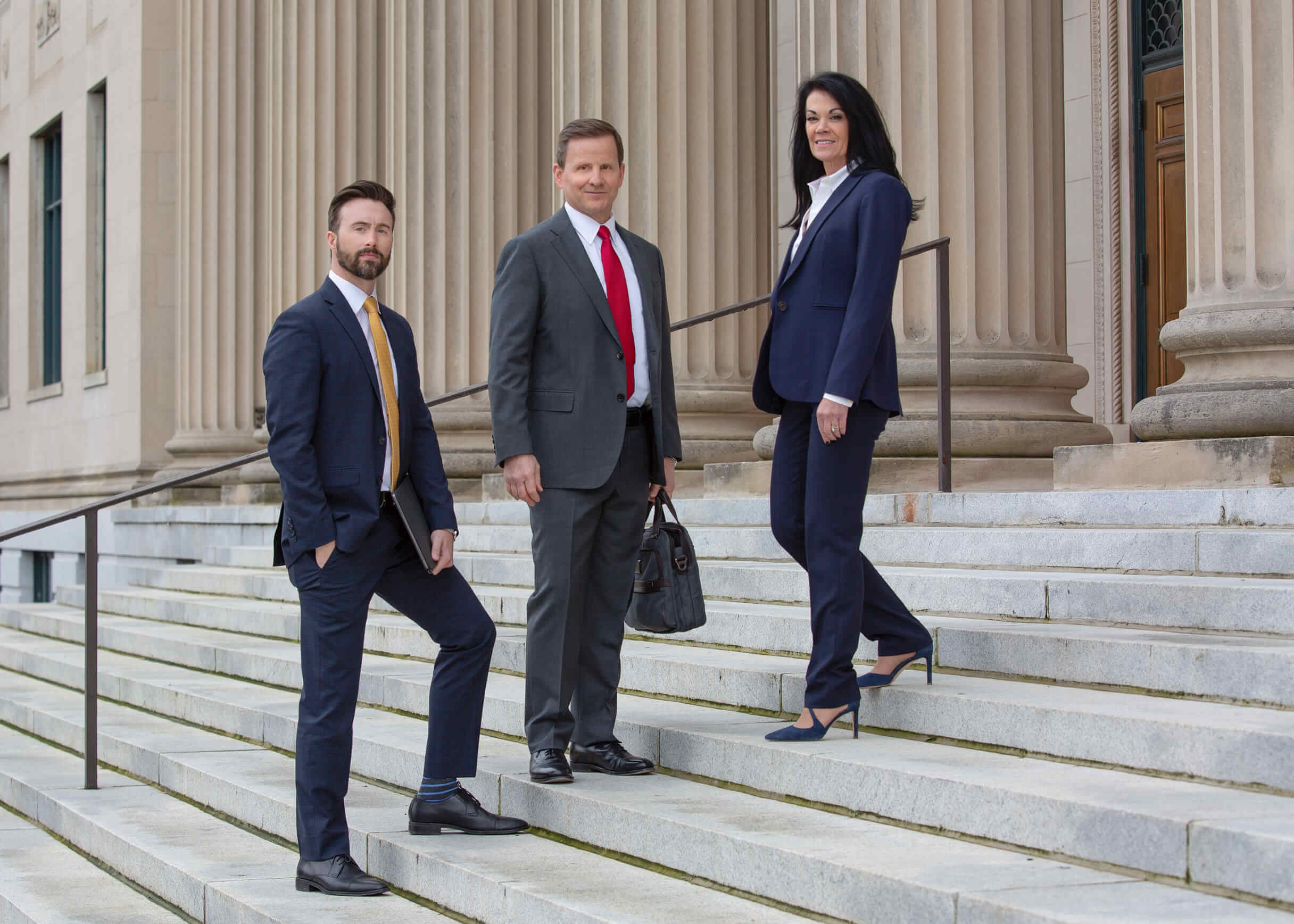 auger-and-auger-lawyer-portrait-outdoor-charlotte-fenixfoto Outdoor image of Auger and Auger Lawyers walking at the Charlote courthouse