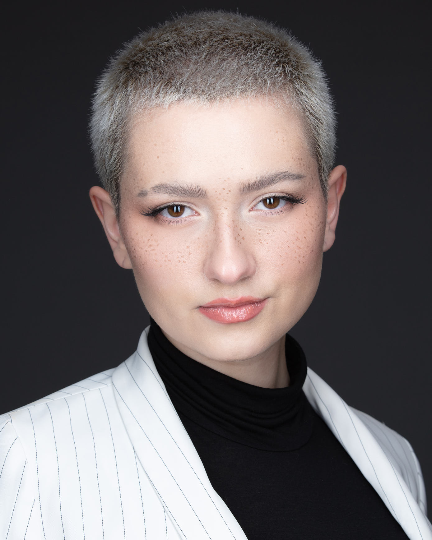 Acting headshot on grey backdrop