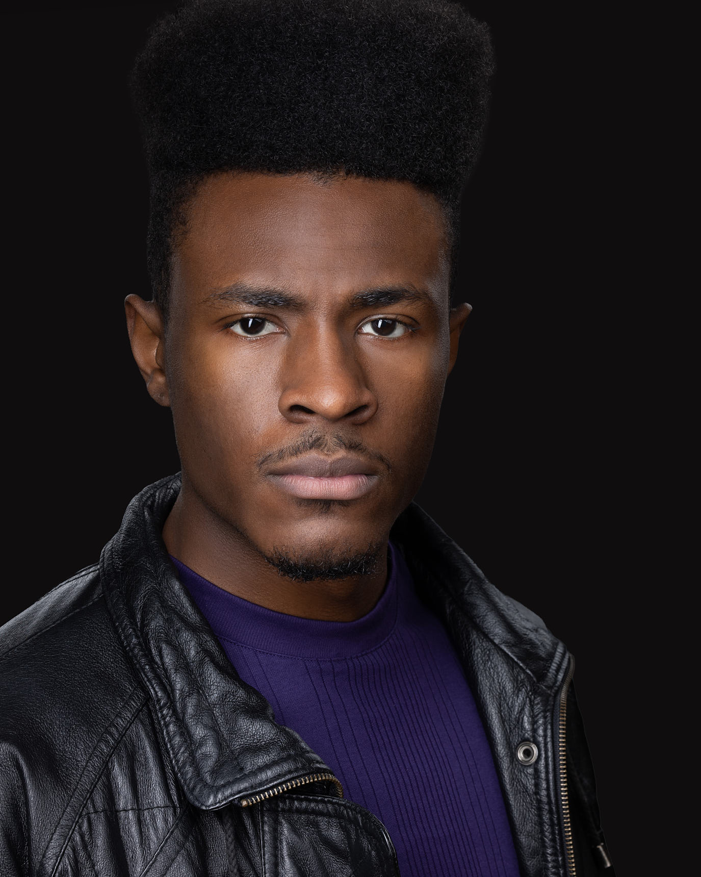Acting headshot on black backdrop