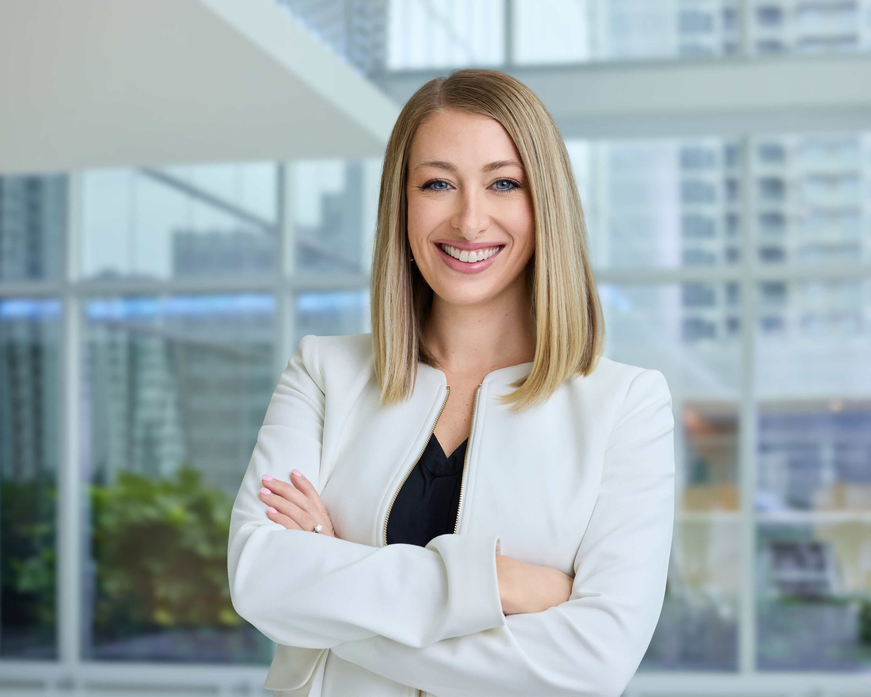 Meredith T. Duke Energy Environmental Portrait – Charlotte Corporate Photography Alt Text Environmental corporate portrait of Meredith T. standing inside the Duke Energy headquarters in Charlotte, NC.